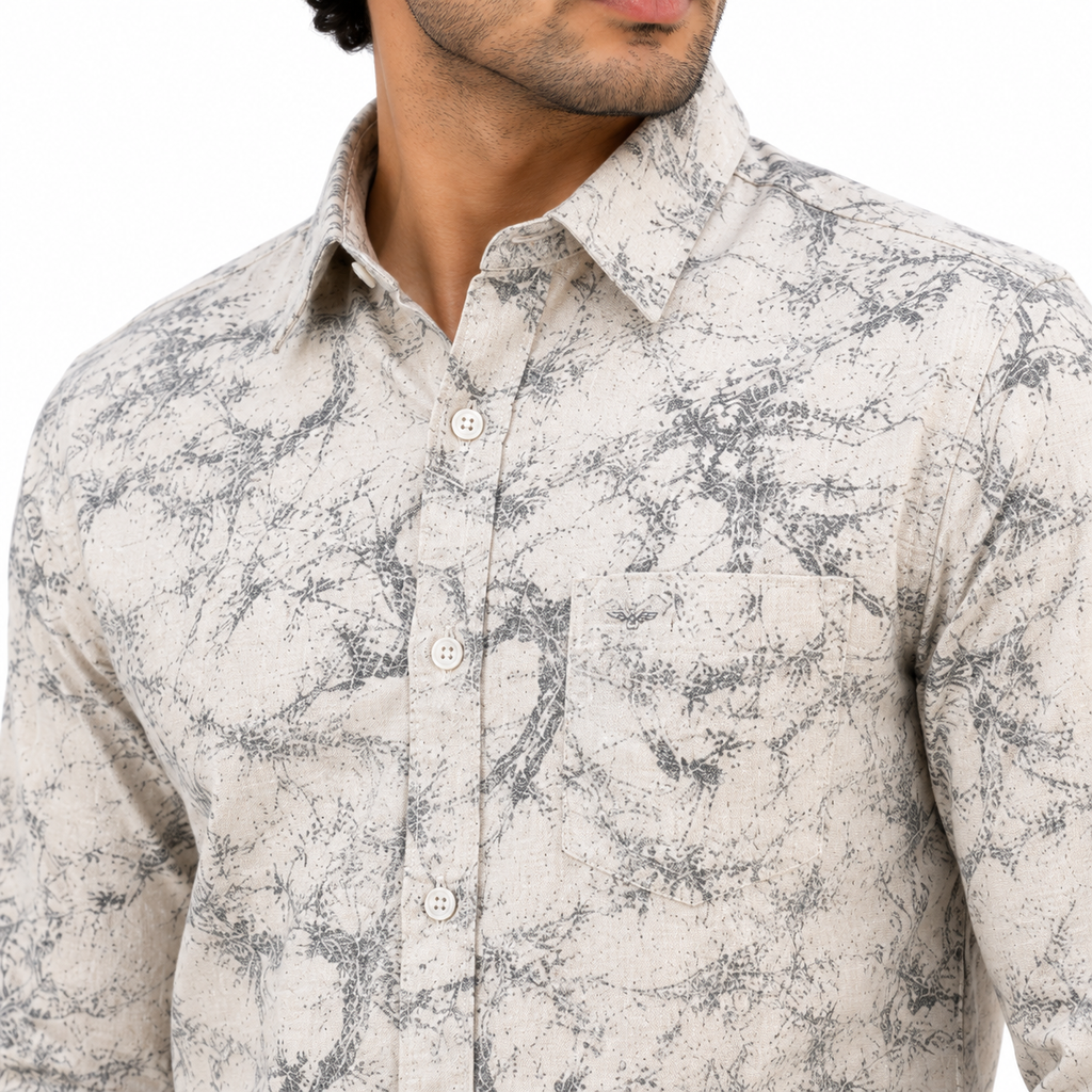 men's printed casual shirt features a grey and white marble-like pattern.